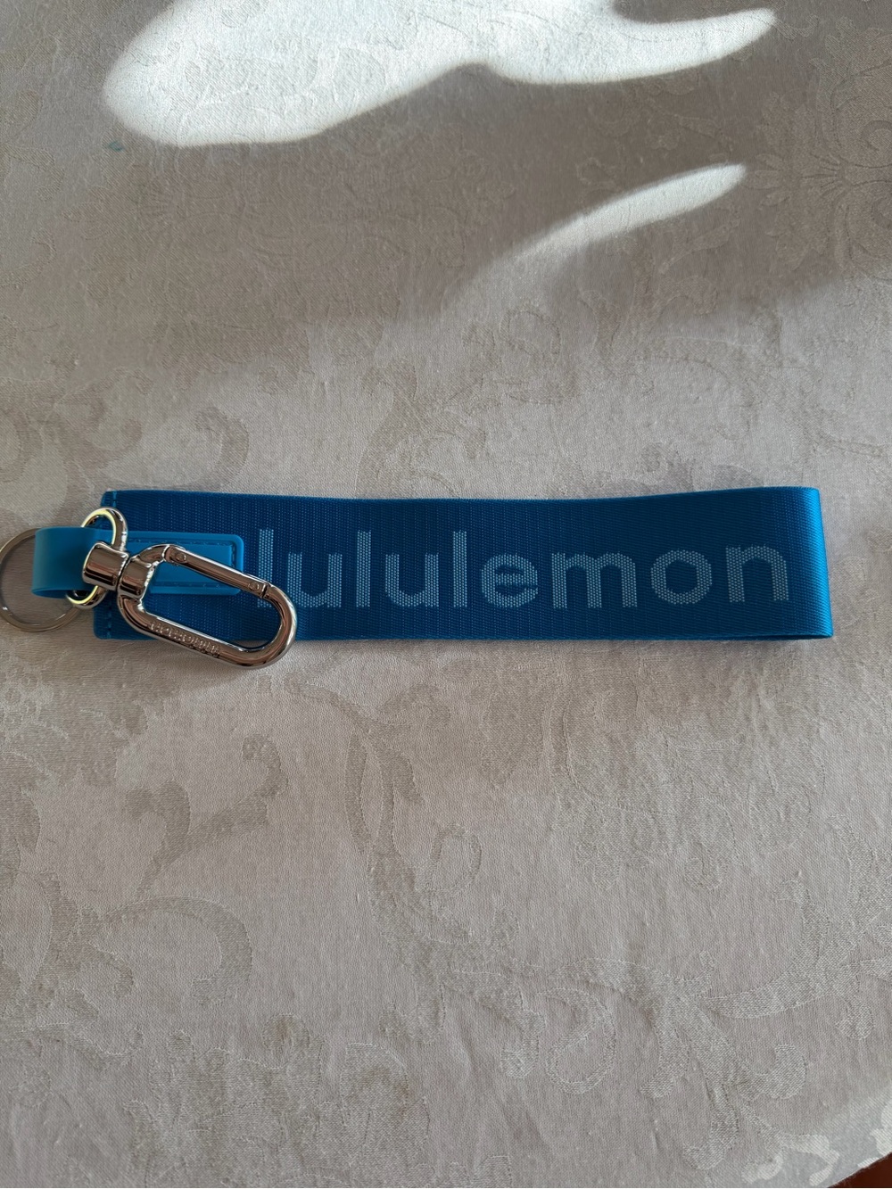 lululemon Never Lost Keychain Blue Silver NWOT